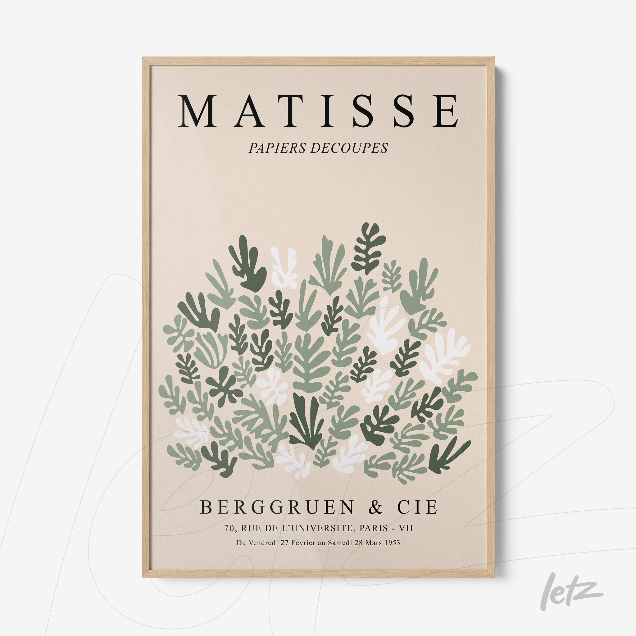 framed wall art inspired by Henri Matisse featuring stylized leaves in shades of green and pink with a light wood frame