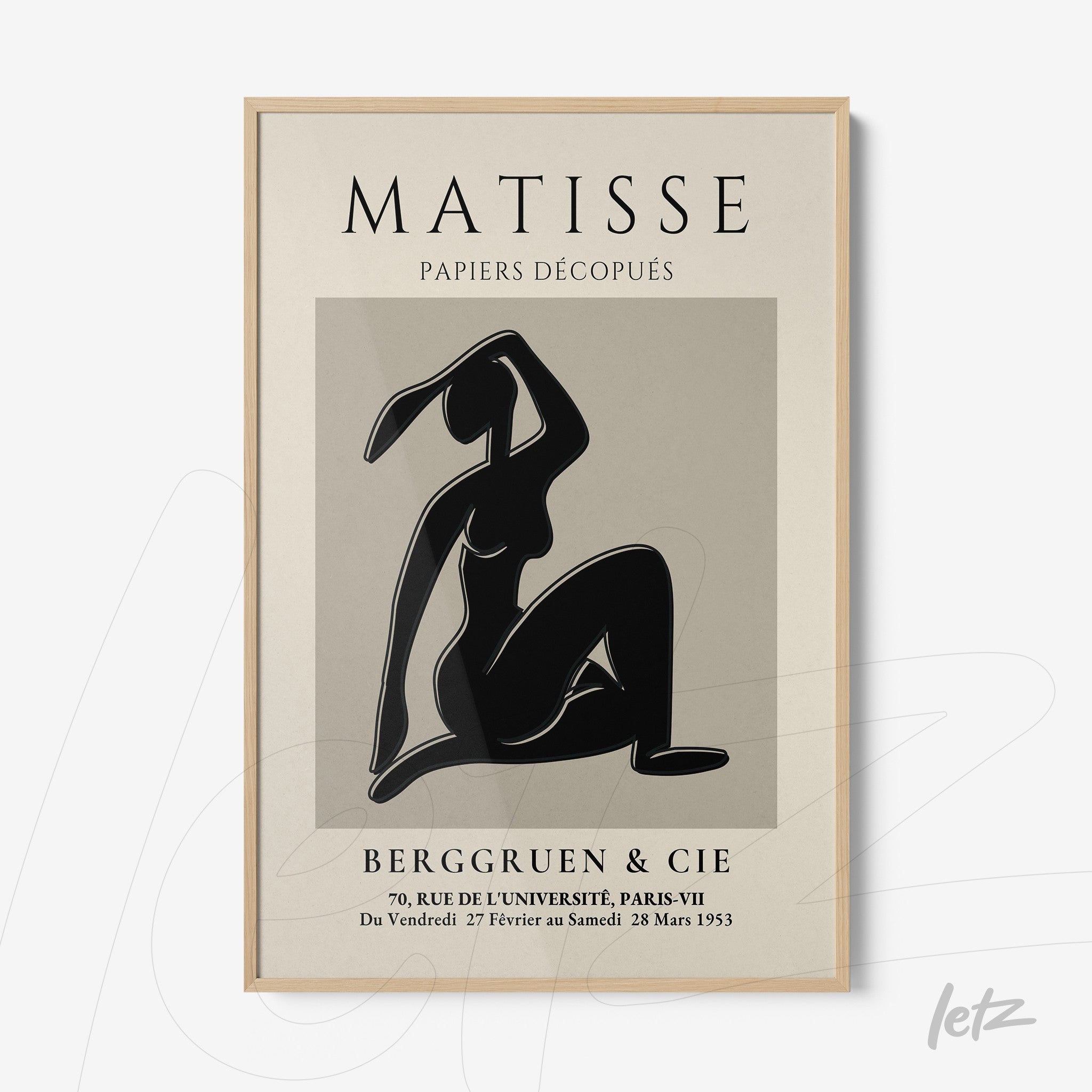 framed artwork of cut-outs by Matisse in light wood frame