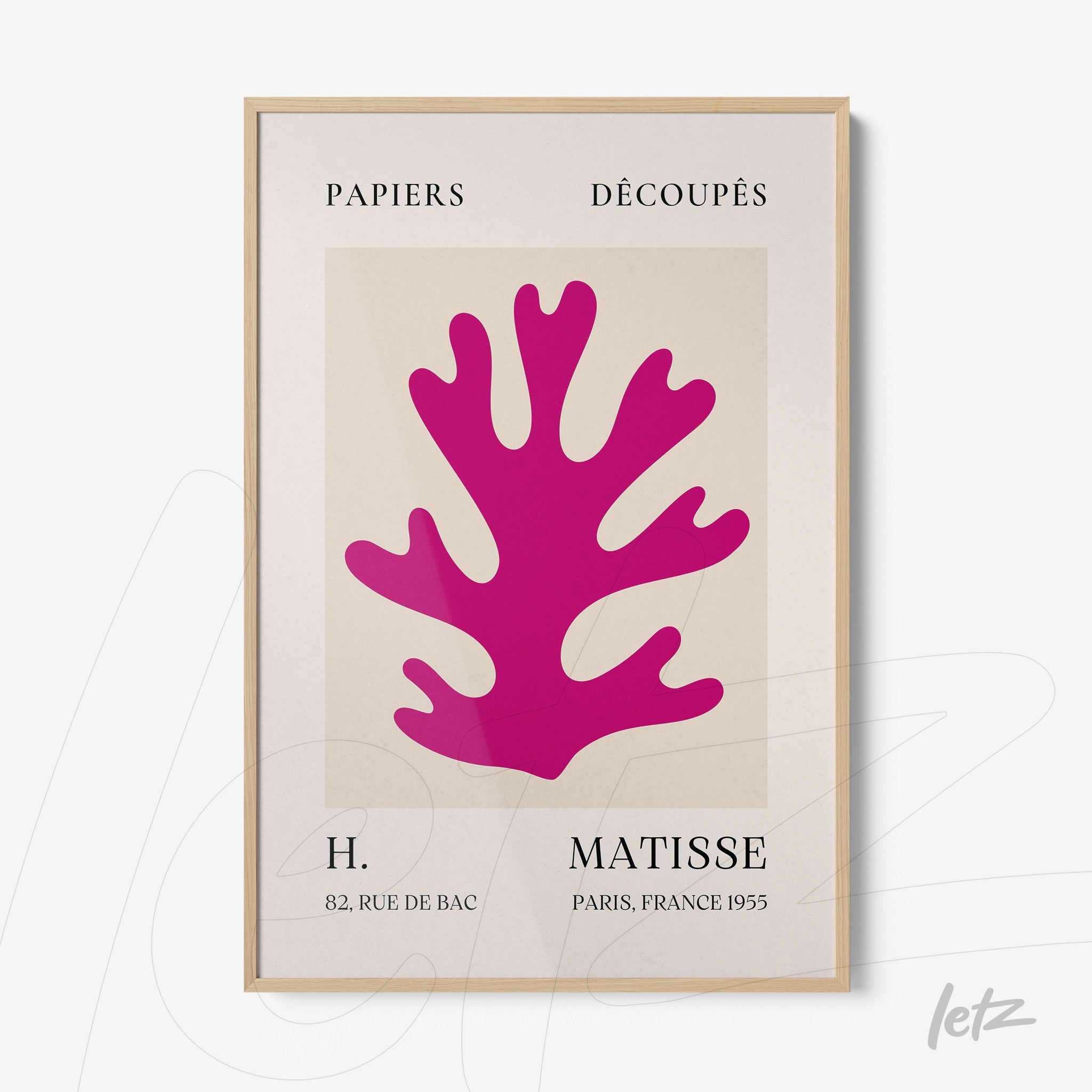 modern wall art featuring a pink coral shape, framed in light wood