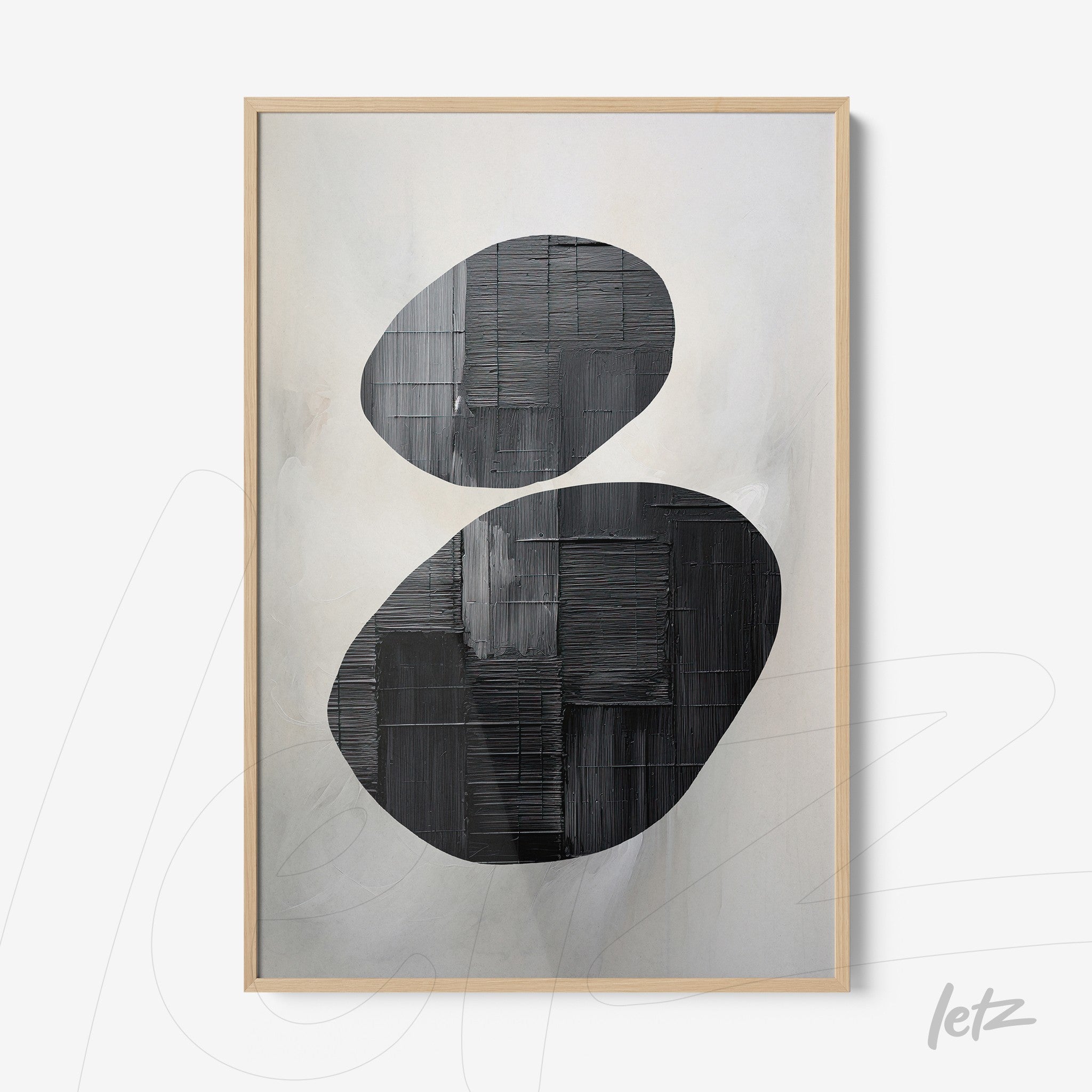 abstract wall art in black and white in light wood frame