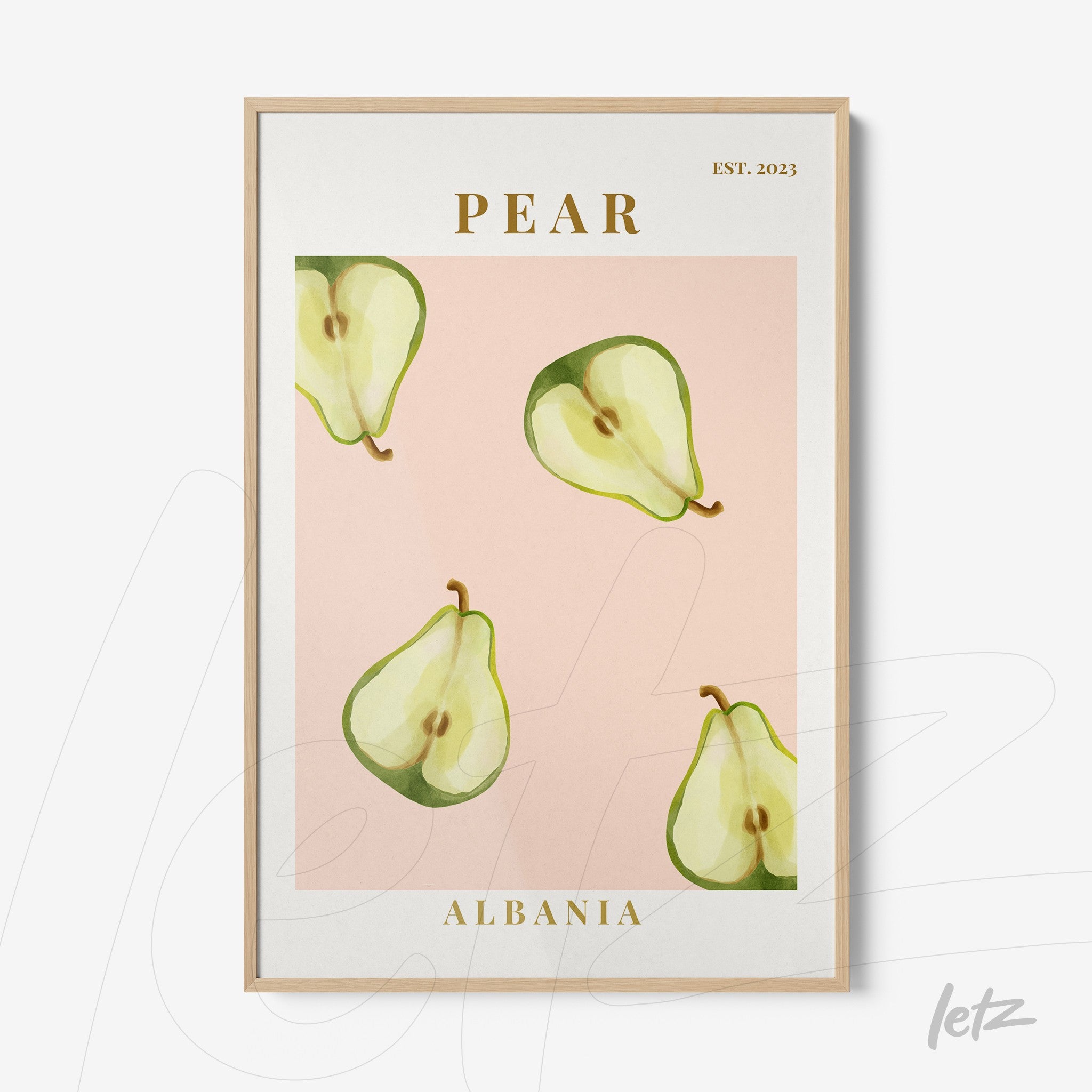 framed art featuring pear illustrations on pink background with light wood frame and golden text