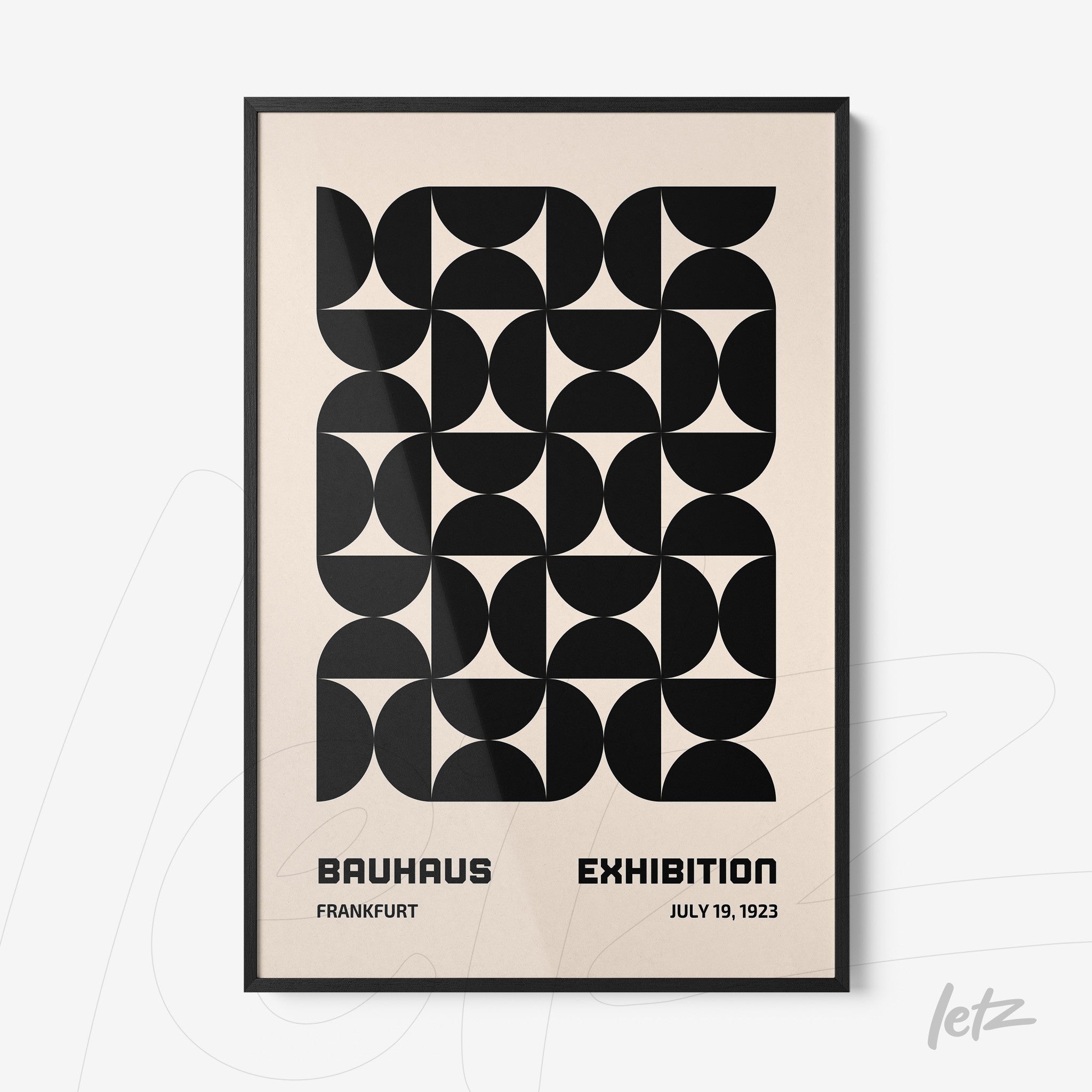 poster with black geometric art on beige background and slim black frame