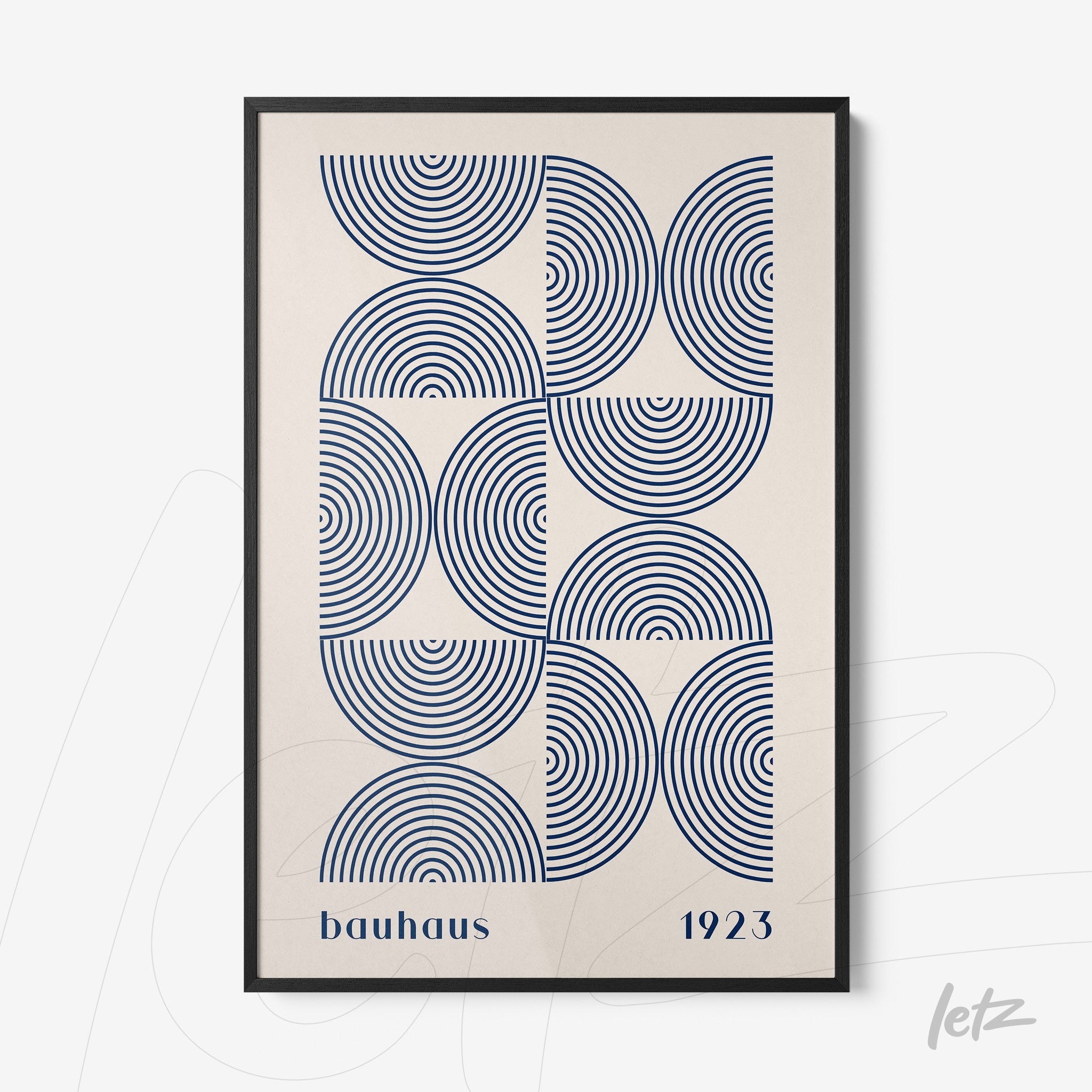 poster with blue geometric pattern and 'bauhaus 1923' text framed in thin black frame