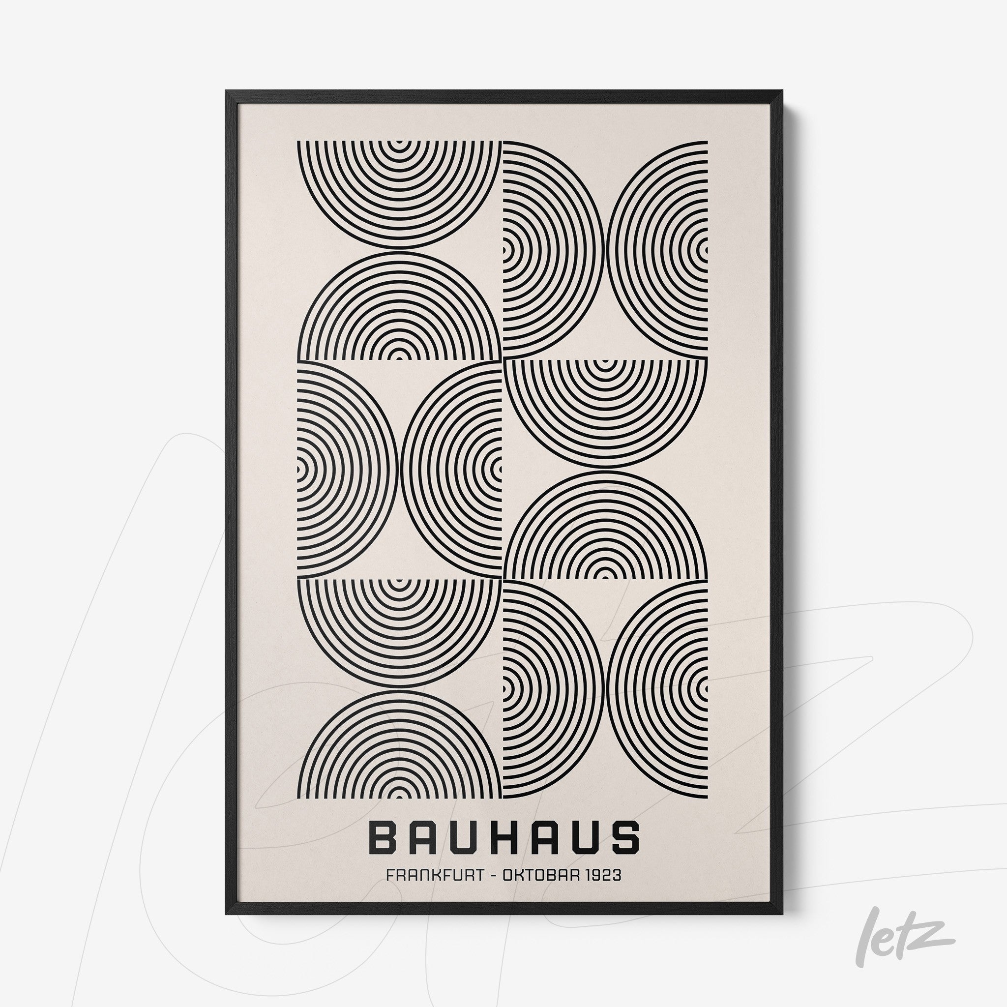 framed wall art featuring geometric design of concentric circles in black on a white background with black frame