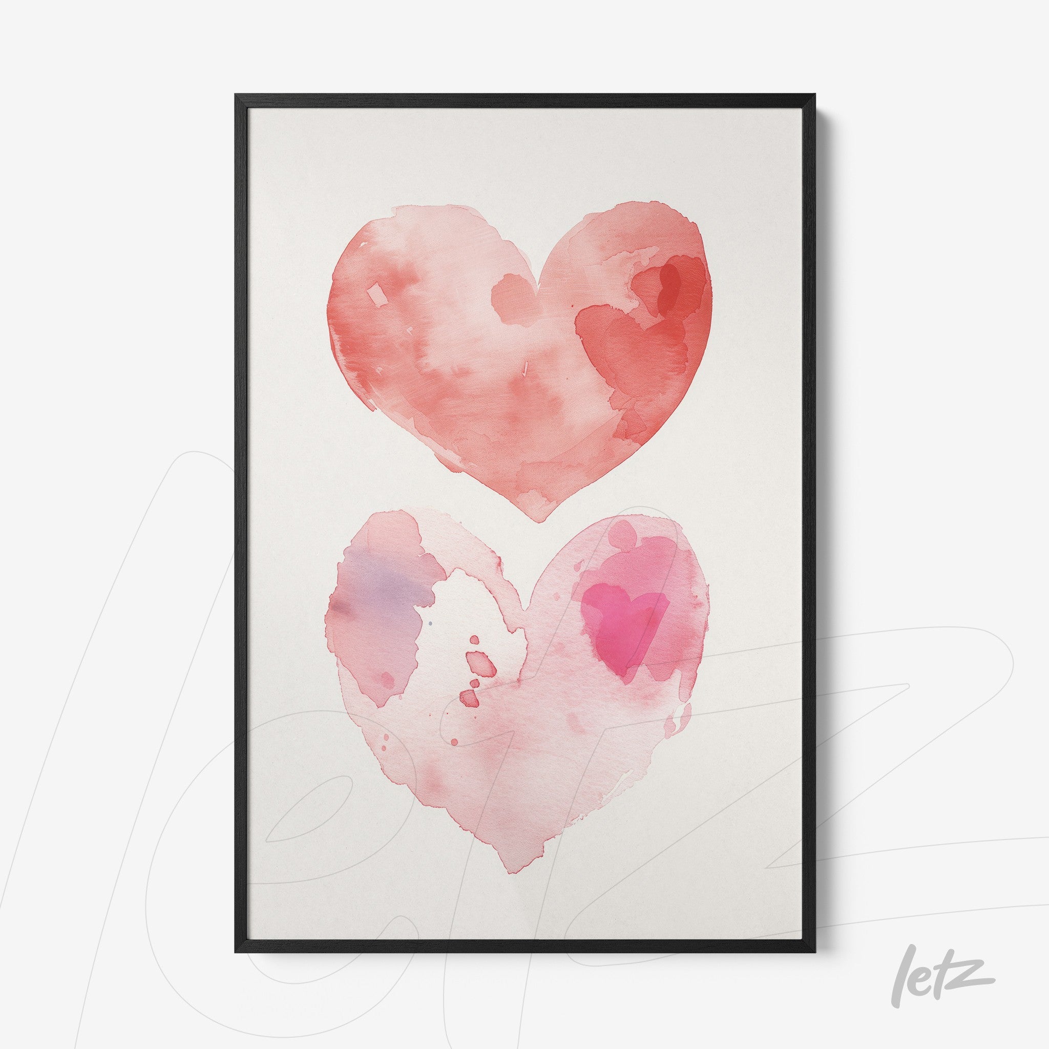 framed watercolor art of two hearts in shades of pink and red with a black frame