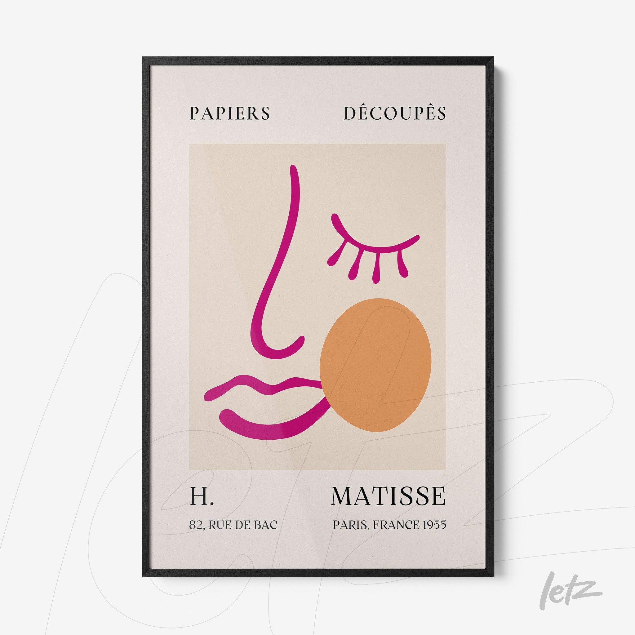 framed artwork featuring an abstract stylized face in vibrant shades of pink and orange