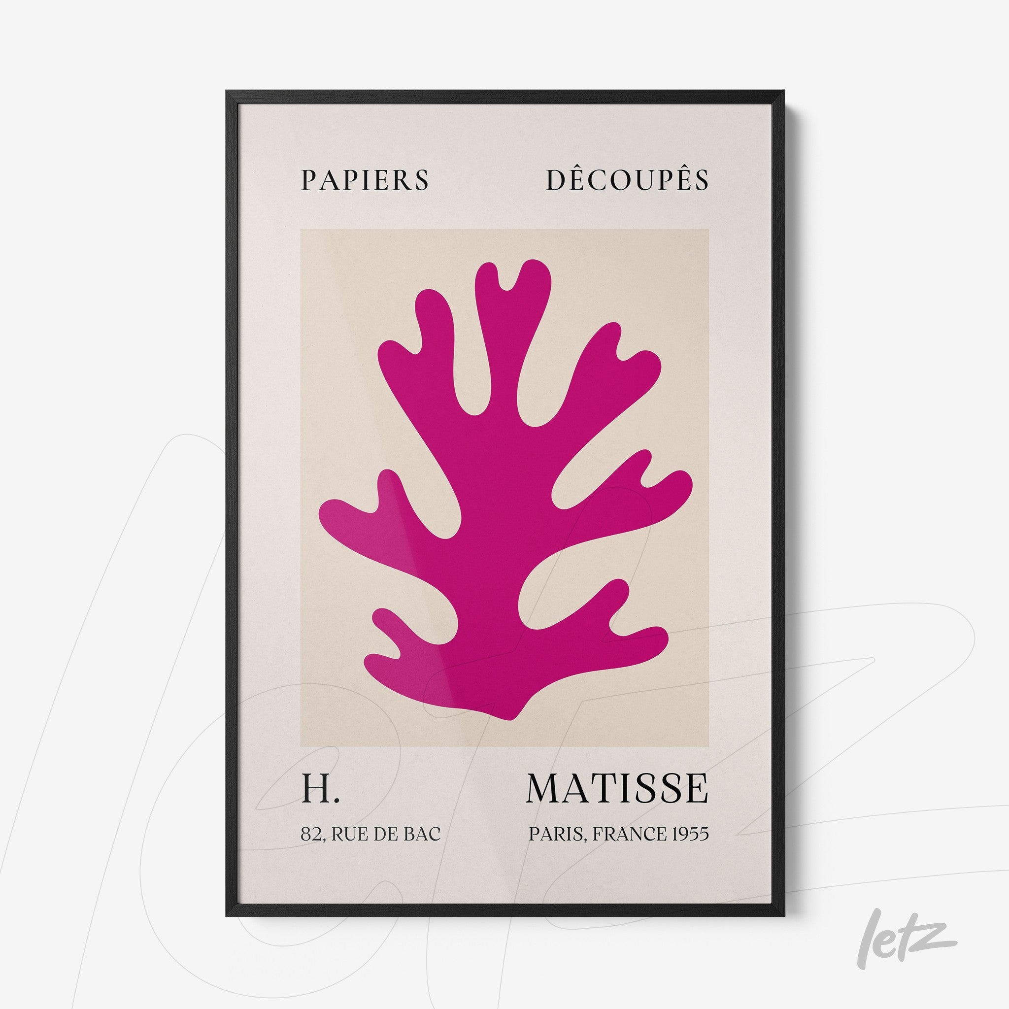 framed art of pink coral shape with black frame, light background and modernist typography