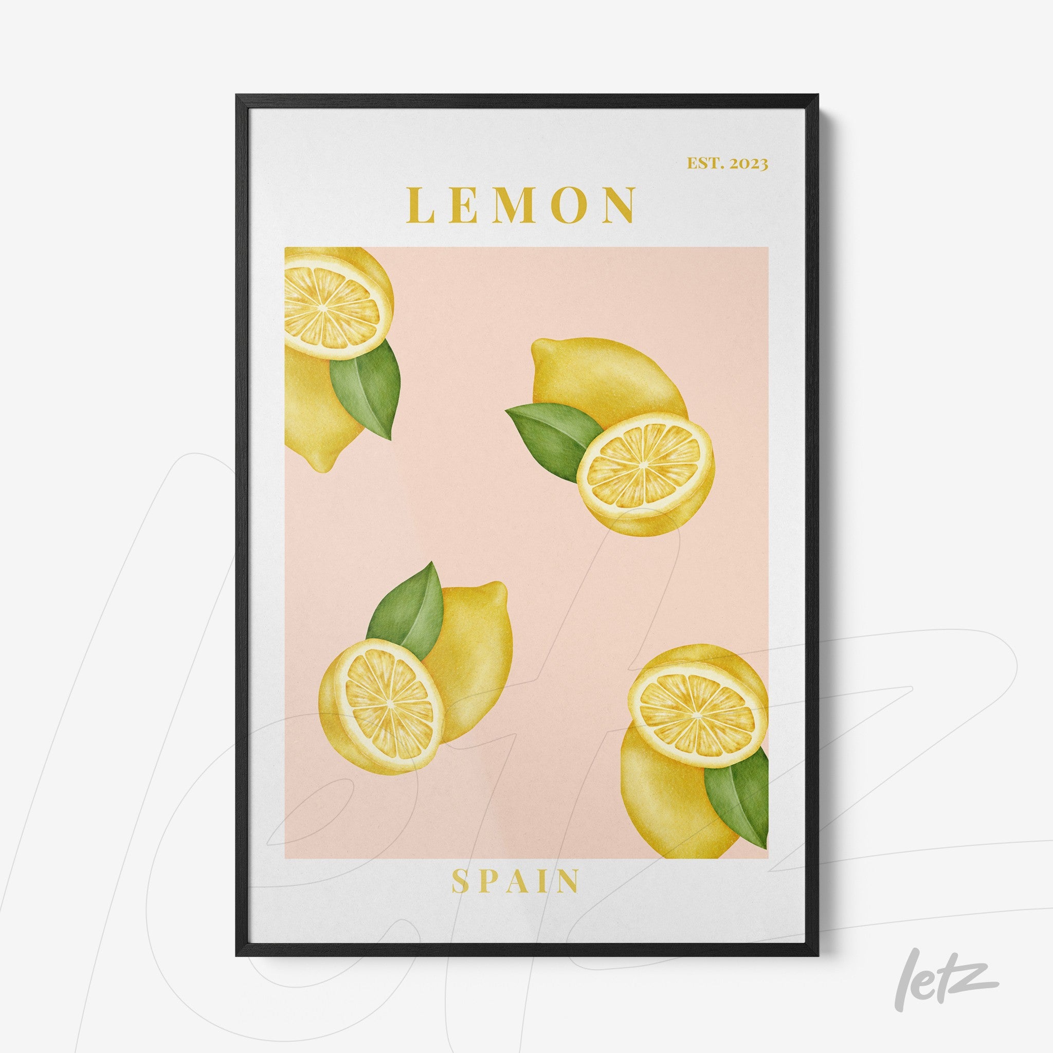 framed artwork featuring lemons on a pink background with black frame and yellow text