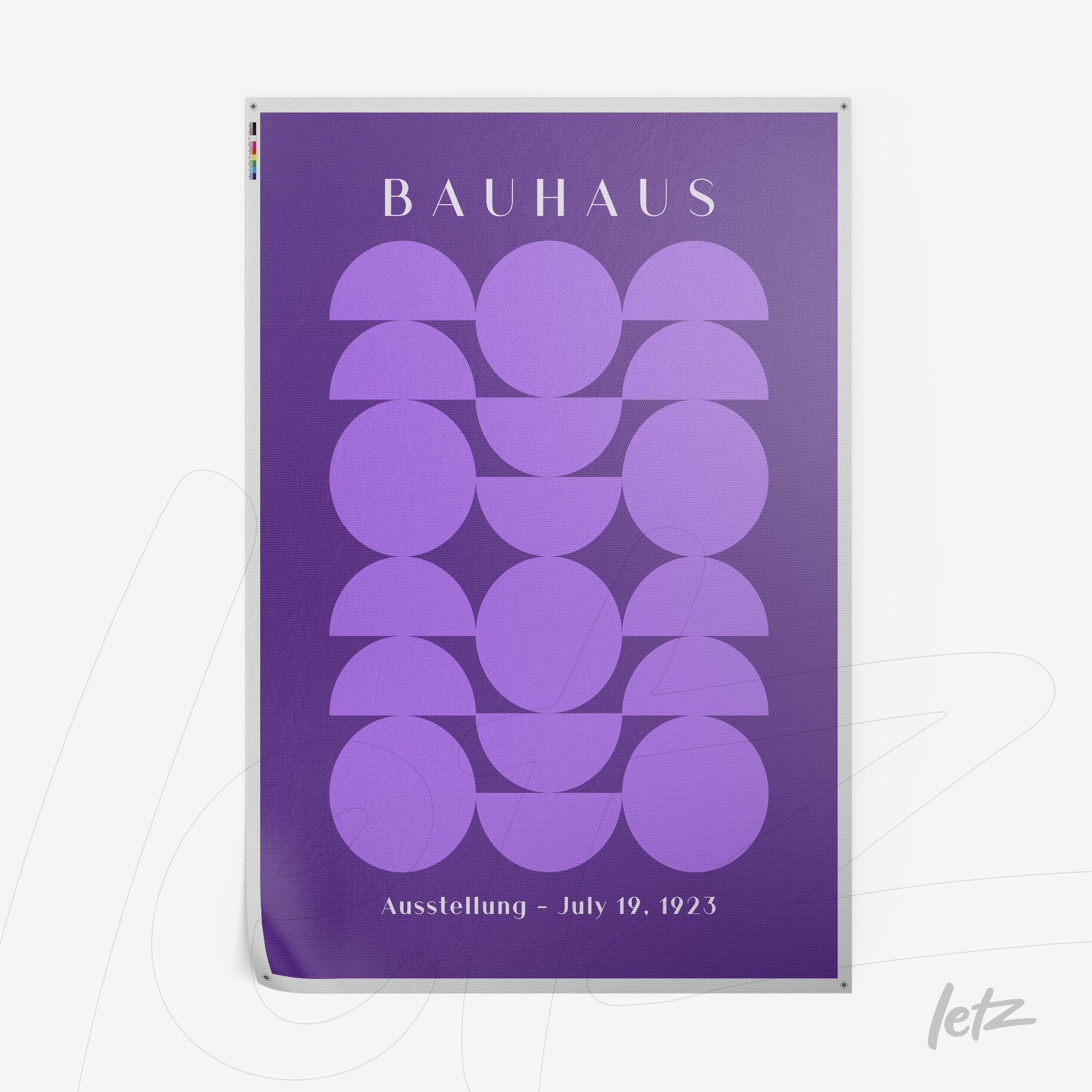 poster featuring geometric design in shades of purple with semicircular and rectangular shapes, the text bauhaus at the top and date july 19, 1923 at the bottom