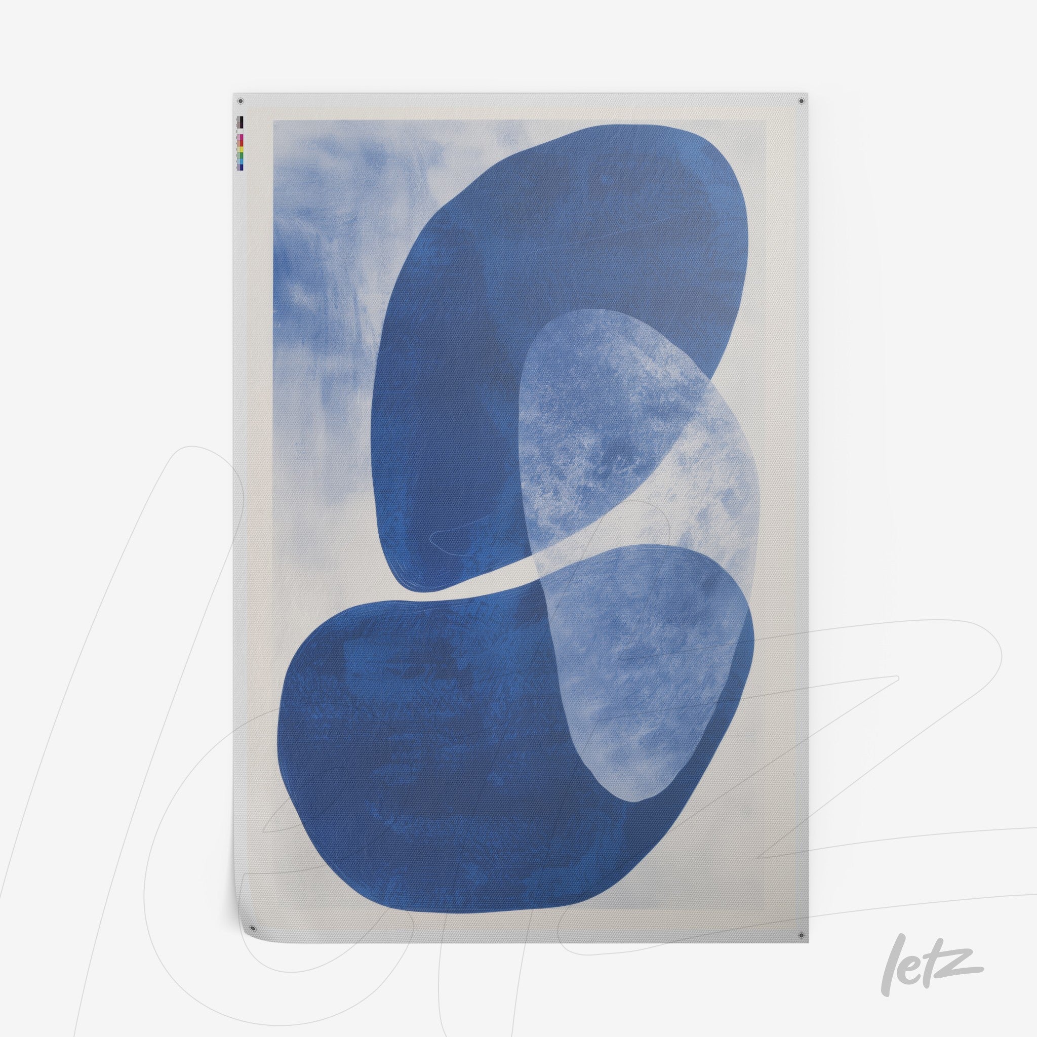 abstract wall art in shades of blue on light background