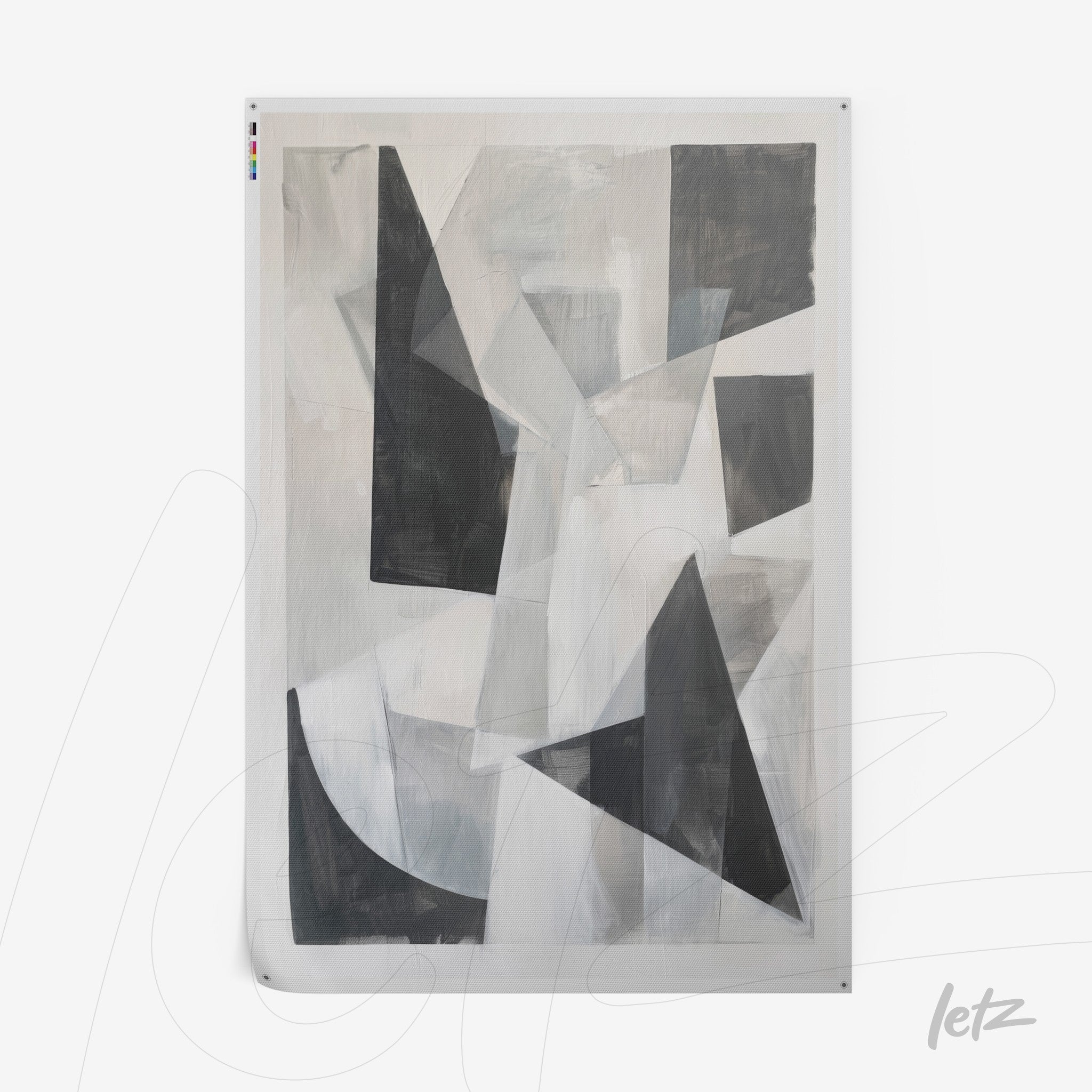 abstract wall art in shades of gray and black featuring geometric shapes on a light background