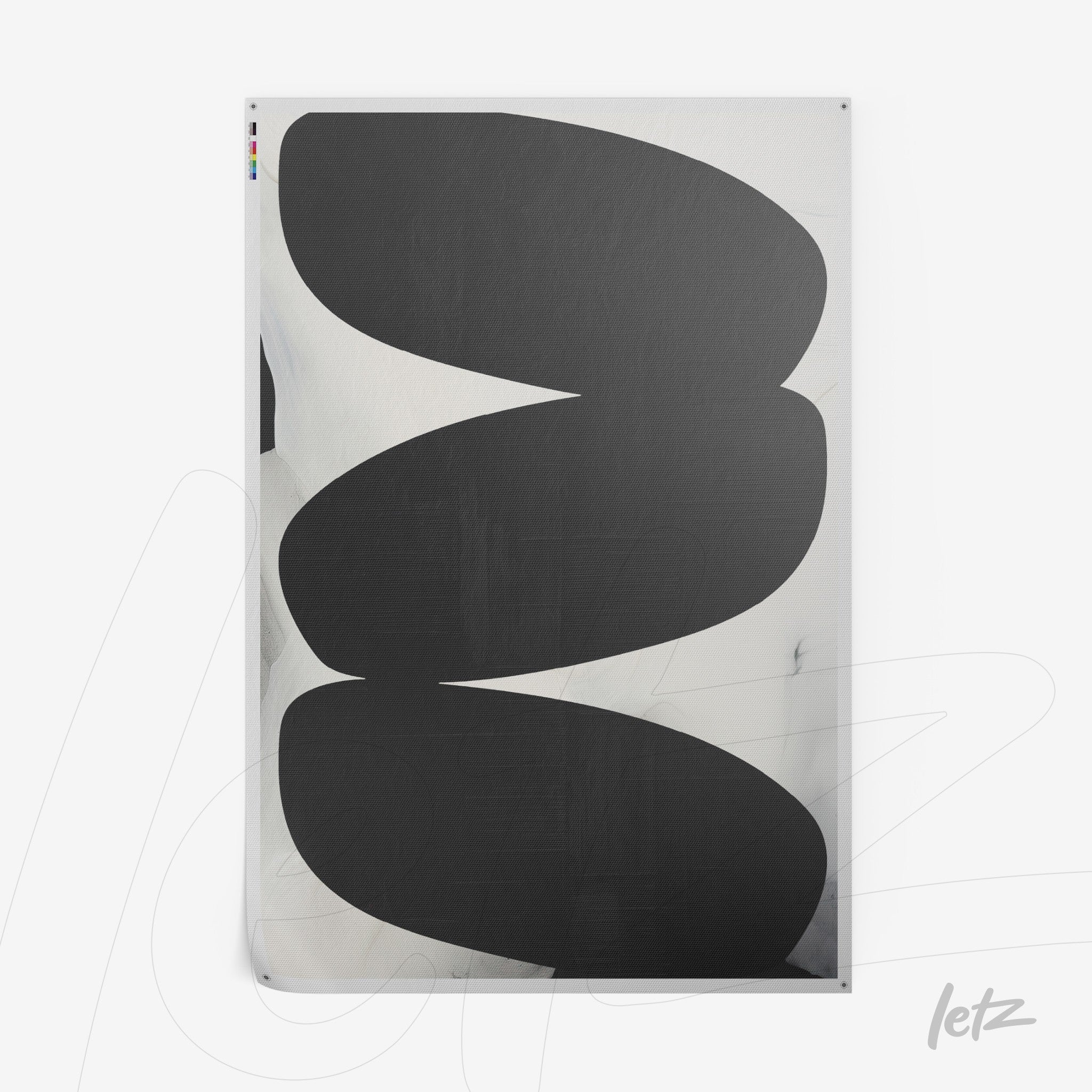 canvas artwork featuring abstract black shapes on a light background