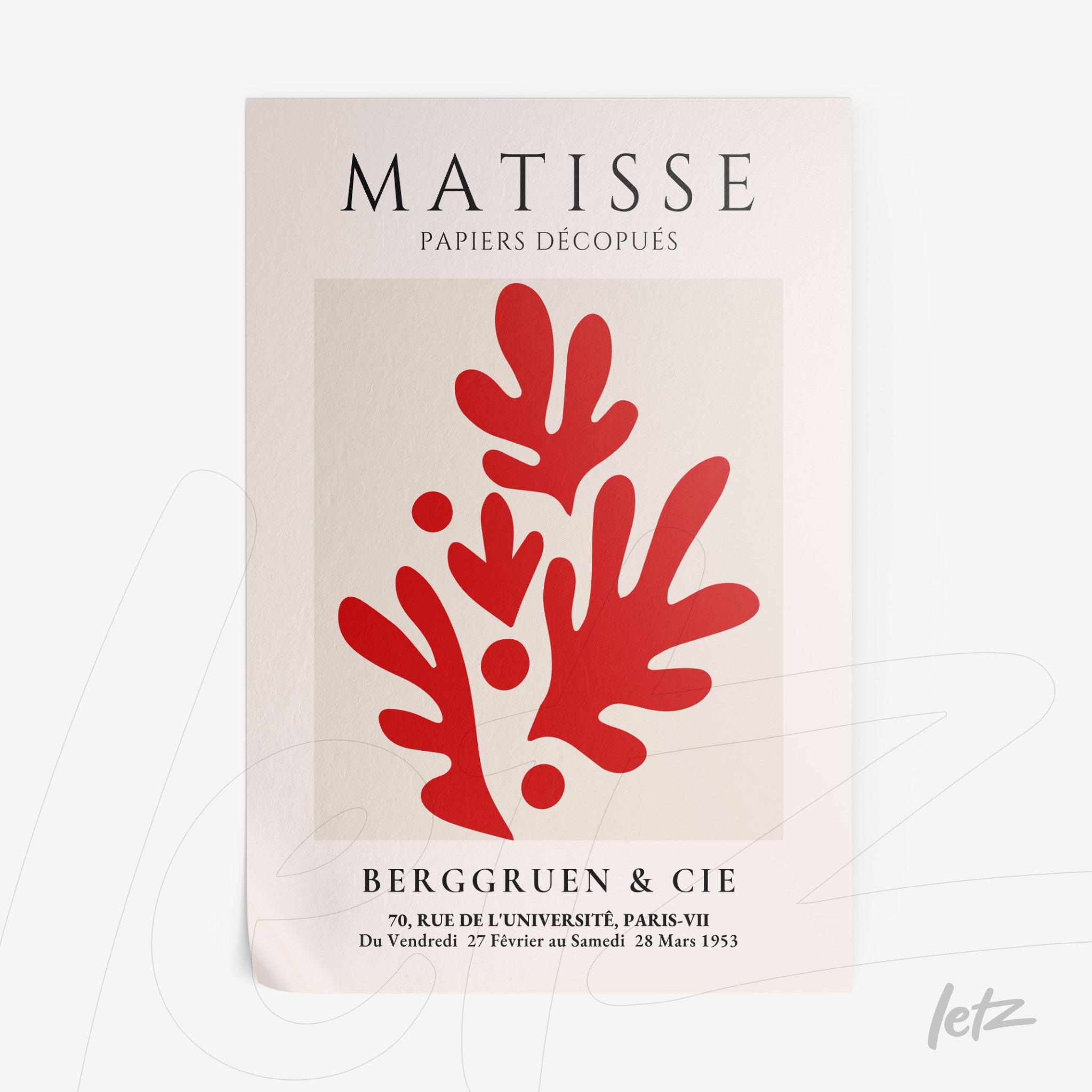 decorative framed art featuring red cut-out shapes on a light background, showcasing organic forms reminiscent of leaves