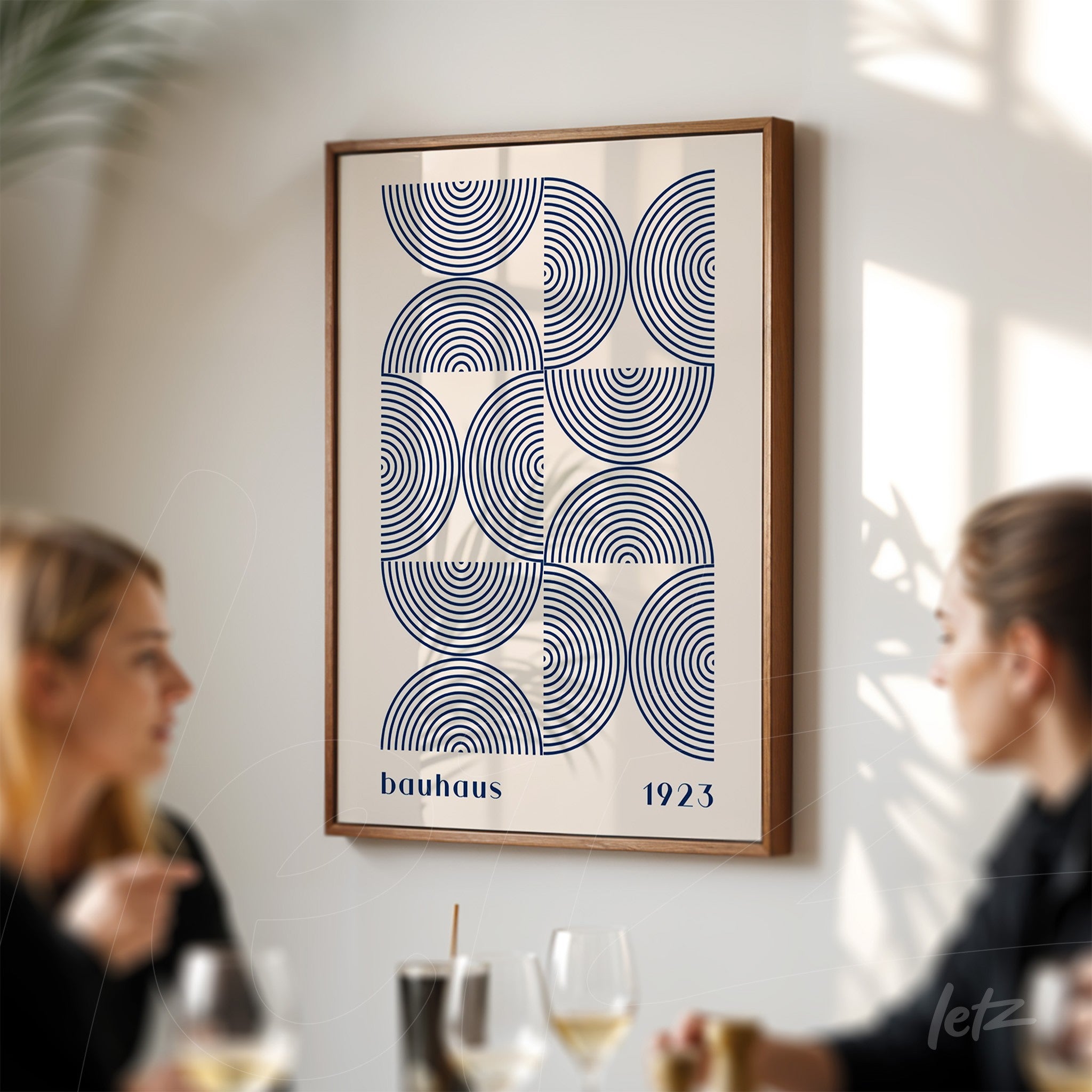 retro framed artwork featuring bauhaus style geometric design with brown frame on white wall
