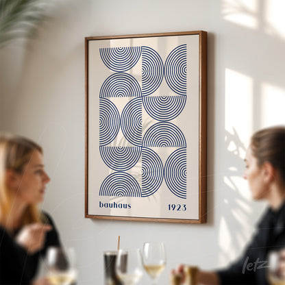retro framed artwork featuring bauhaus style geometric design with brown frame on white wall
