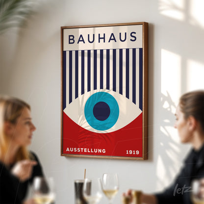 poster print with modernist bauhaus style design in wooden frame, displayed on white wall during meeting