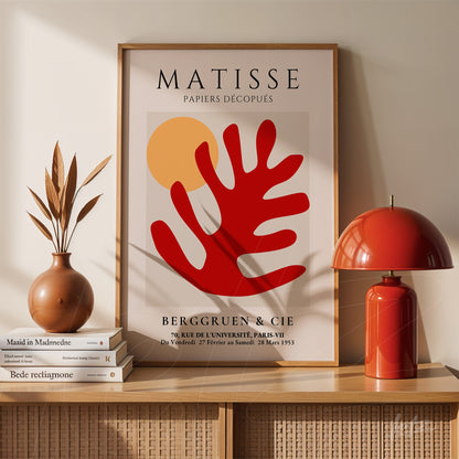 framed modern art print featuring a red leaf shape with a neutral background and yellow circle
