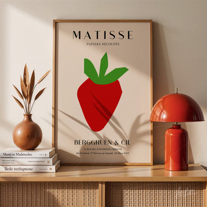 framed modern art piece featuring a stylized strawberry against a neutral background