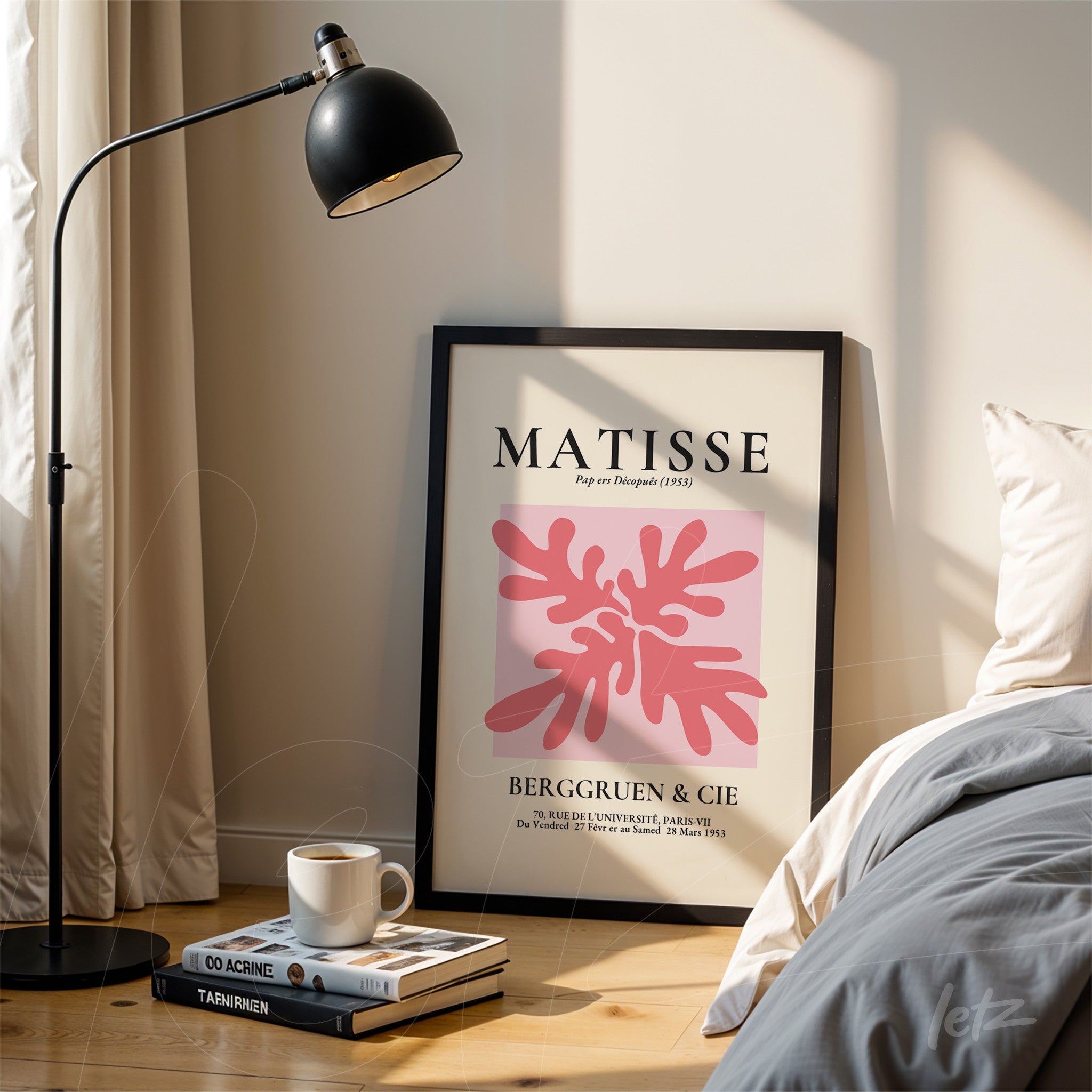 framed artwork featuring abstract pink leaf shapes titled 'MATISSE' with modern typography, displayed next to a floor lamp on a light wall