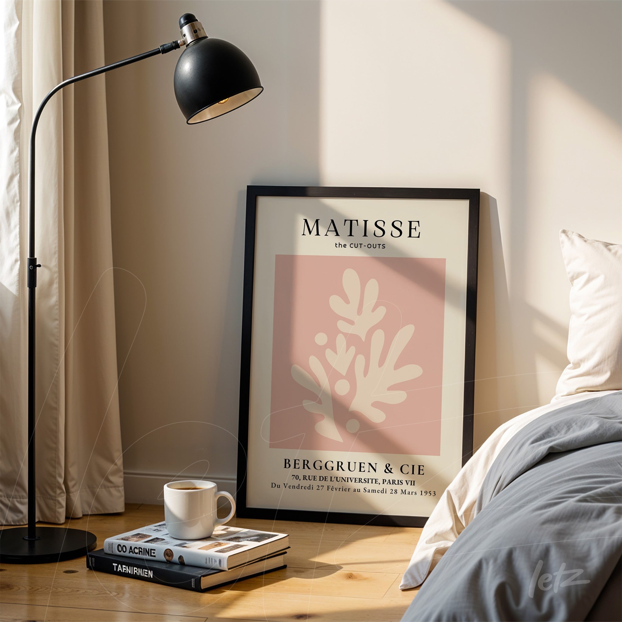 framed wall art of Matisse's cut-outs in black frame with pink background displayed near a lamp and bed