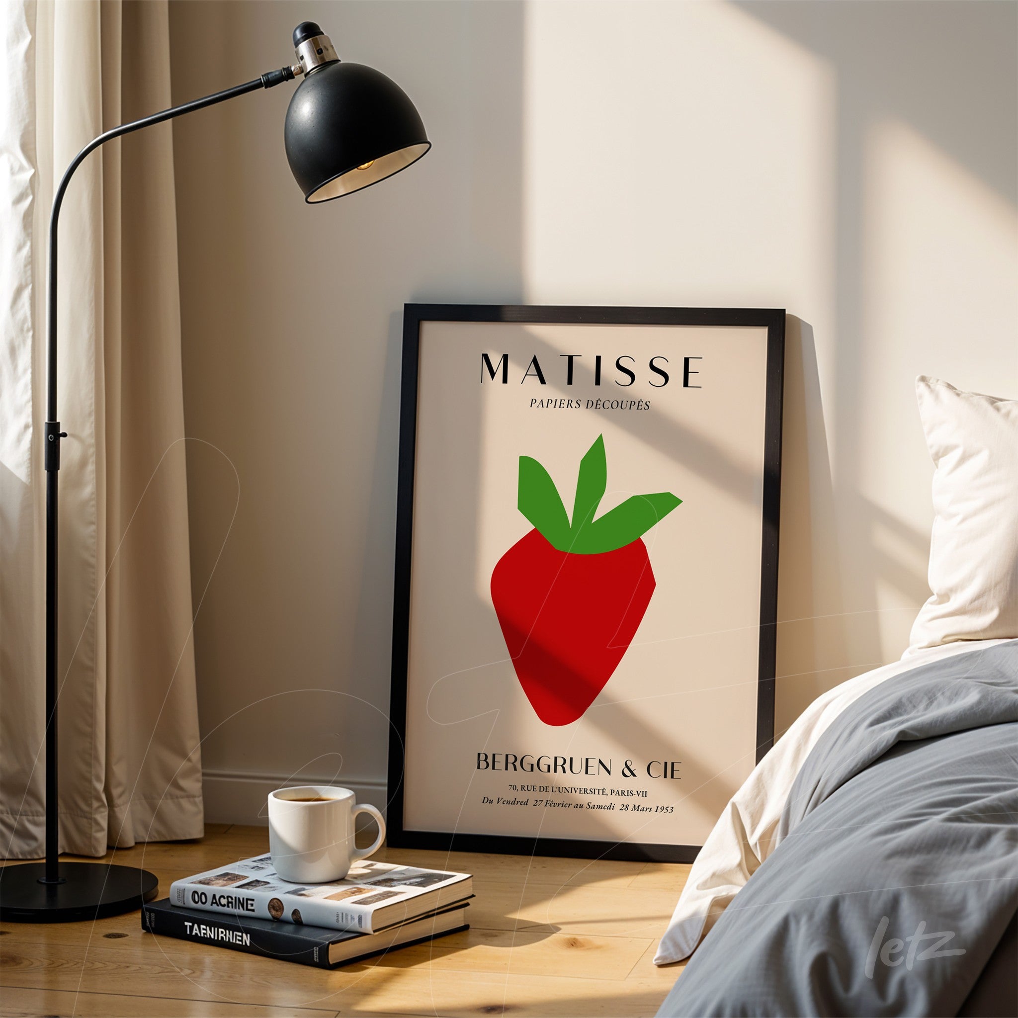 framed wall art featuring a stylized strawberry illustration with a light background, positioned beside a lamp on wooden floor