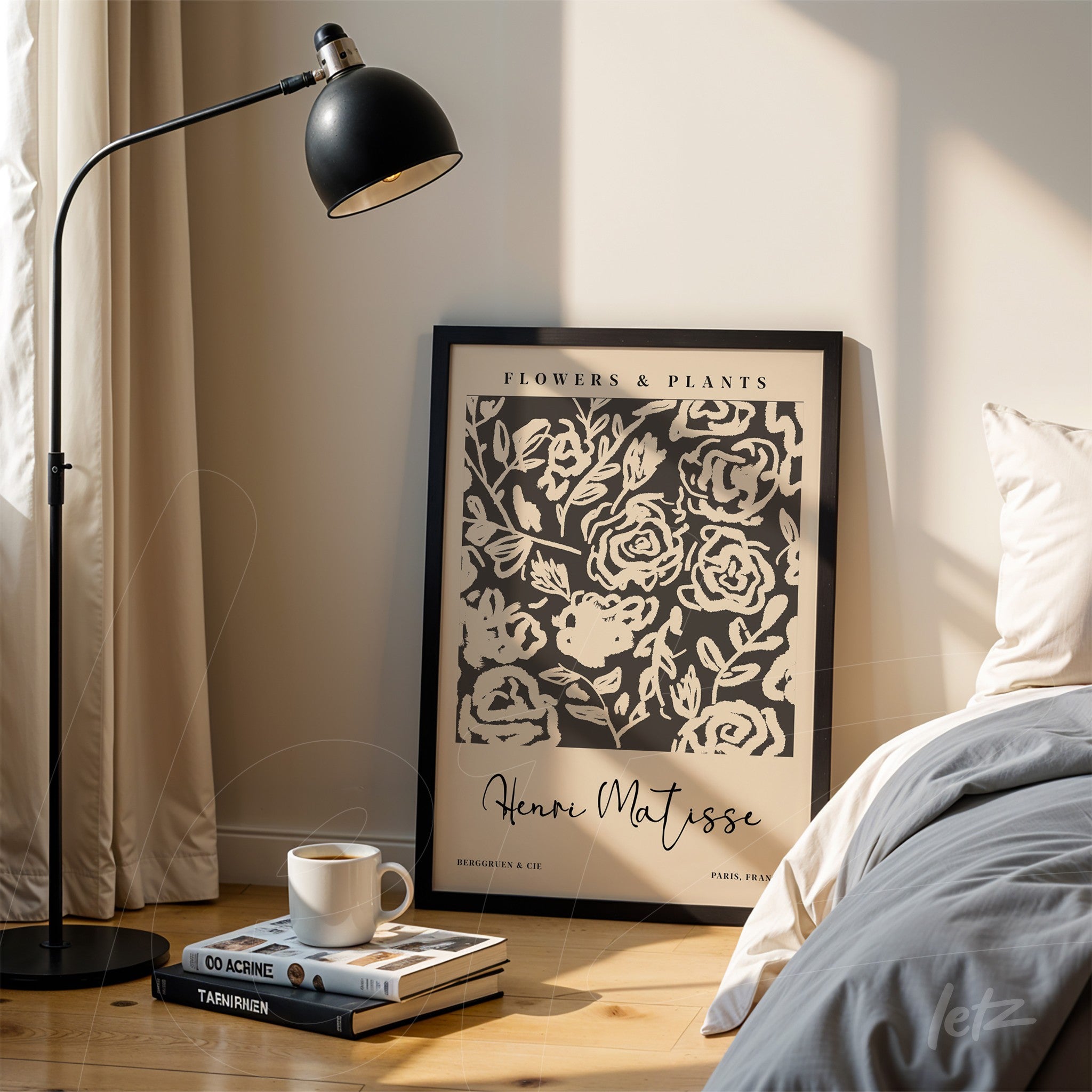framed wall art with modern floral illustration in black, displayed next to a floor lamp in a cozy setting