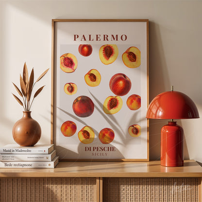 modern art print of peaches in light wooden frame displayed on wooden table