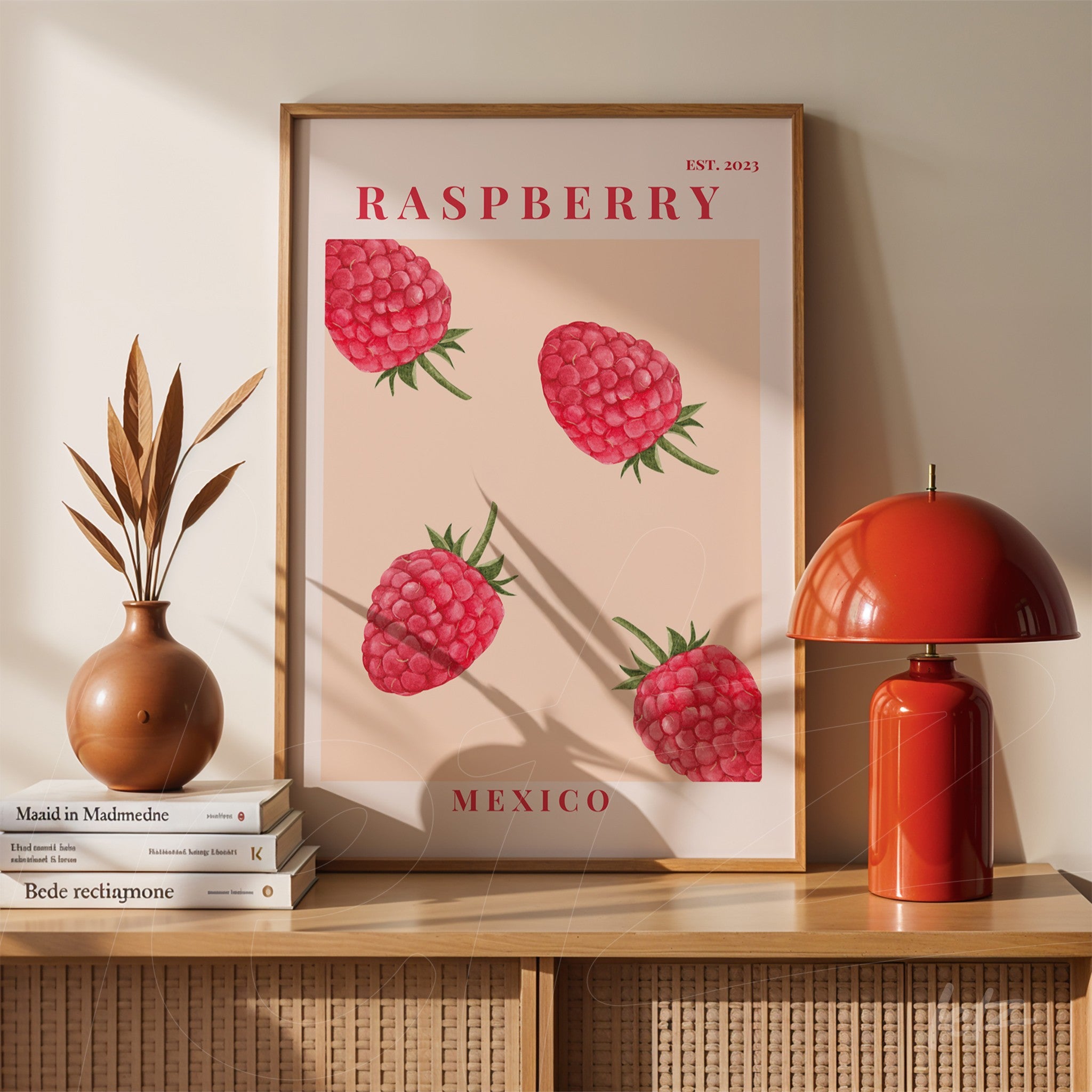 framed wall art featuring illustrated raspberries on beige background with light wood frame