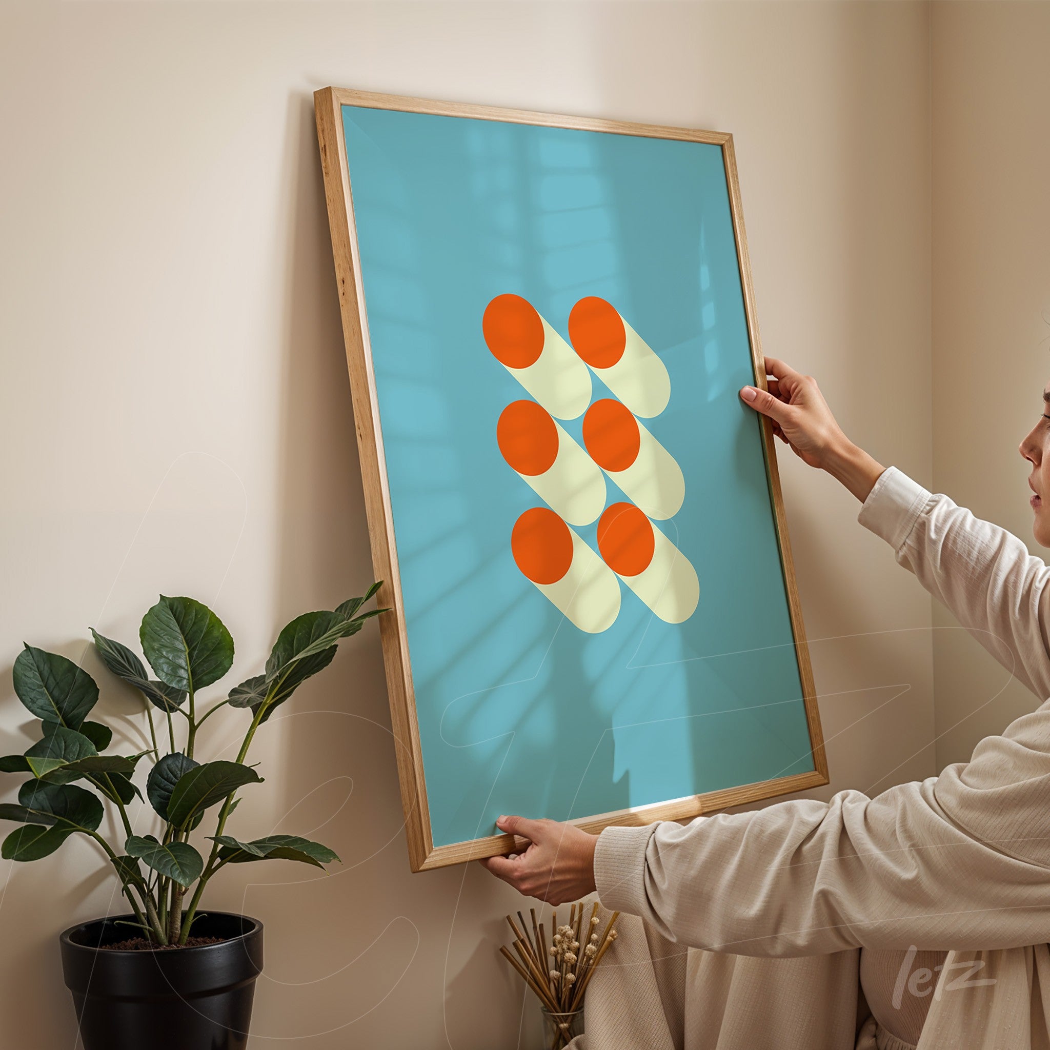 digital geometric art with orange and yellow circles on a blue background in a light wood frame