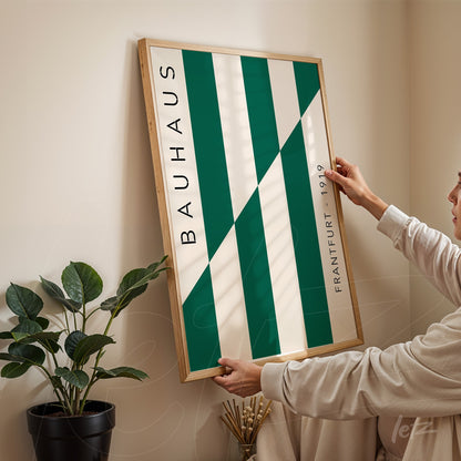 modern style poster with diagonal green and white stripes and the word bauhaus on the side in a light frame
