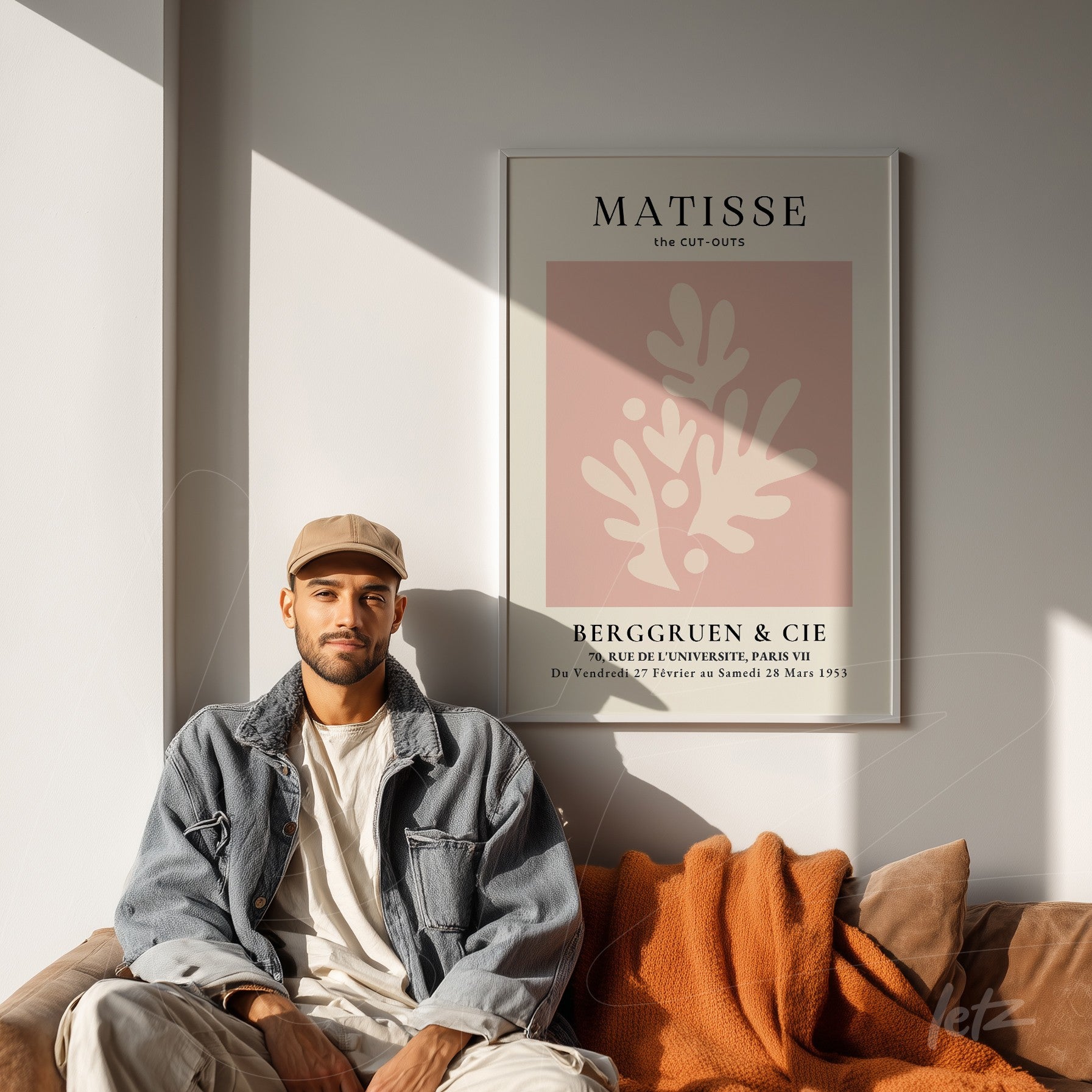 framed modern art featuring matisse cut-outs in earthy tones displayed on a light wall