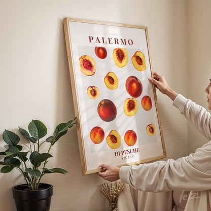 framed wall art featuring peaches illustration on white background, highlighting the text 'Palermo di Pesche Sicily' in elegant font, displayed in a bright setting