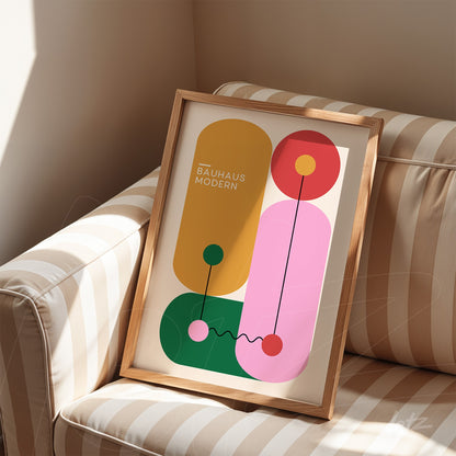 bauhaus style modern art with geometric shapes in light wood frame on striped sofa
