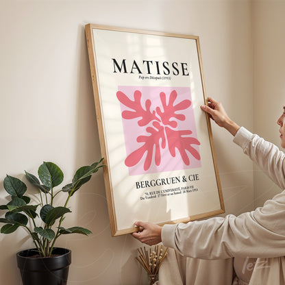 framed modern art print featuring pink background with organic shapes in red and pink tones