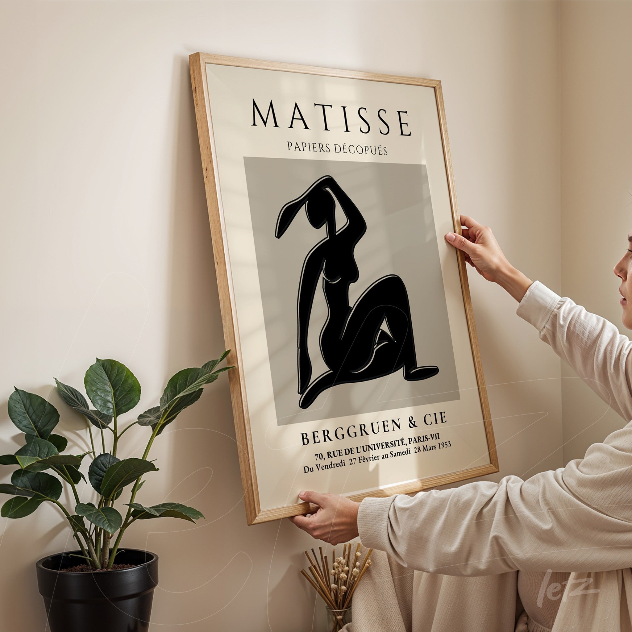 vintage style framed artwork of a human figure with light wooden frame