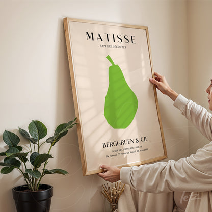 framed artwork inspired by Matisse featuring a green pear on a light background