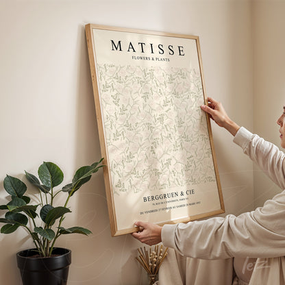 decorative wall art featuring floral design by Matisse, showcased in light wooden frame against neutral wall
