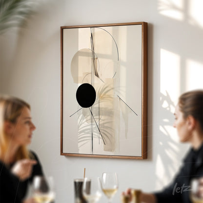 modern art piece featuring abstract design in light wood frame displayed on wall illuminated by natural light