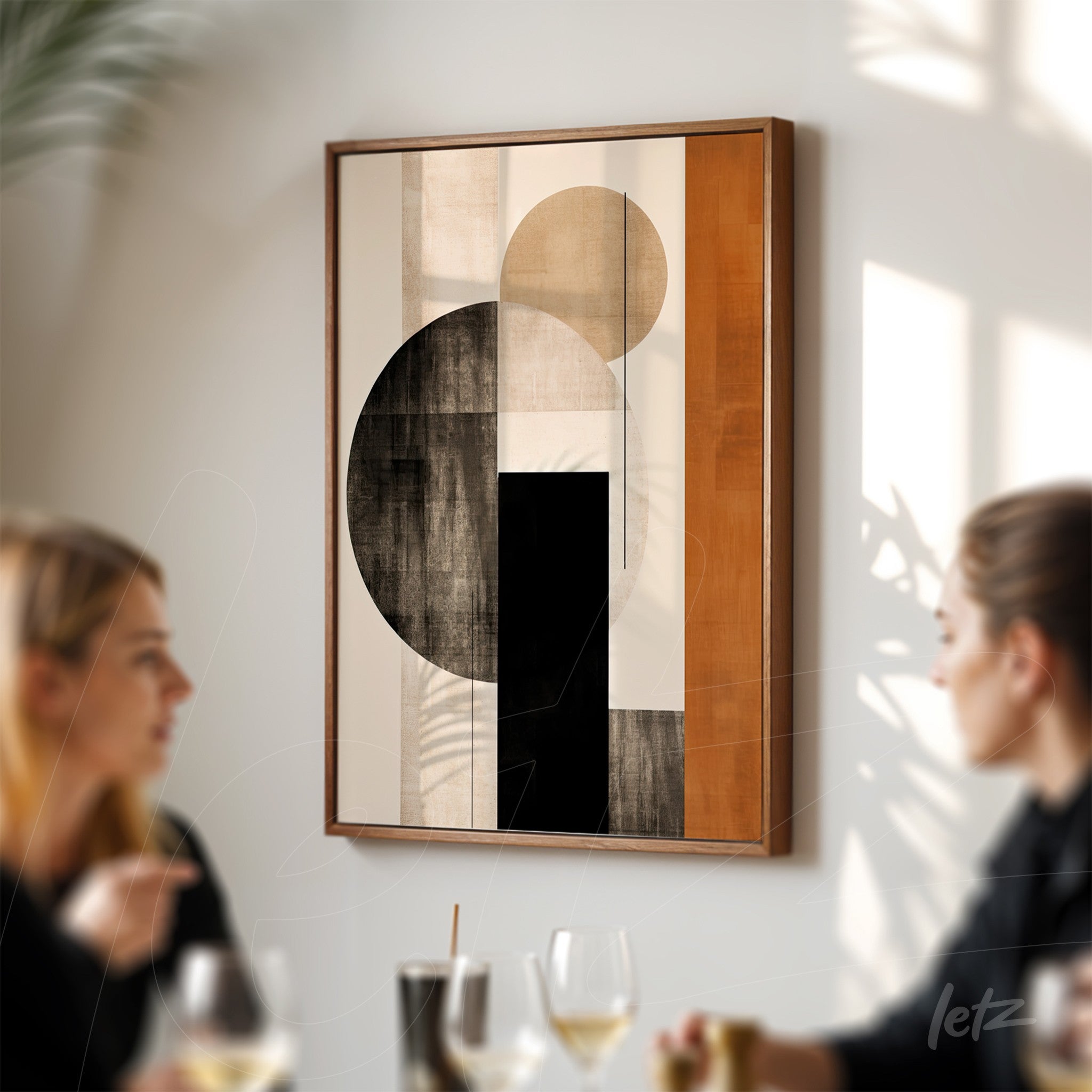 abstract wall art featuring geometric shapes in earthy tones with wooden frame displayed on a light wall