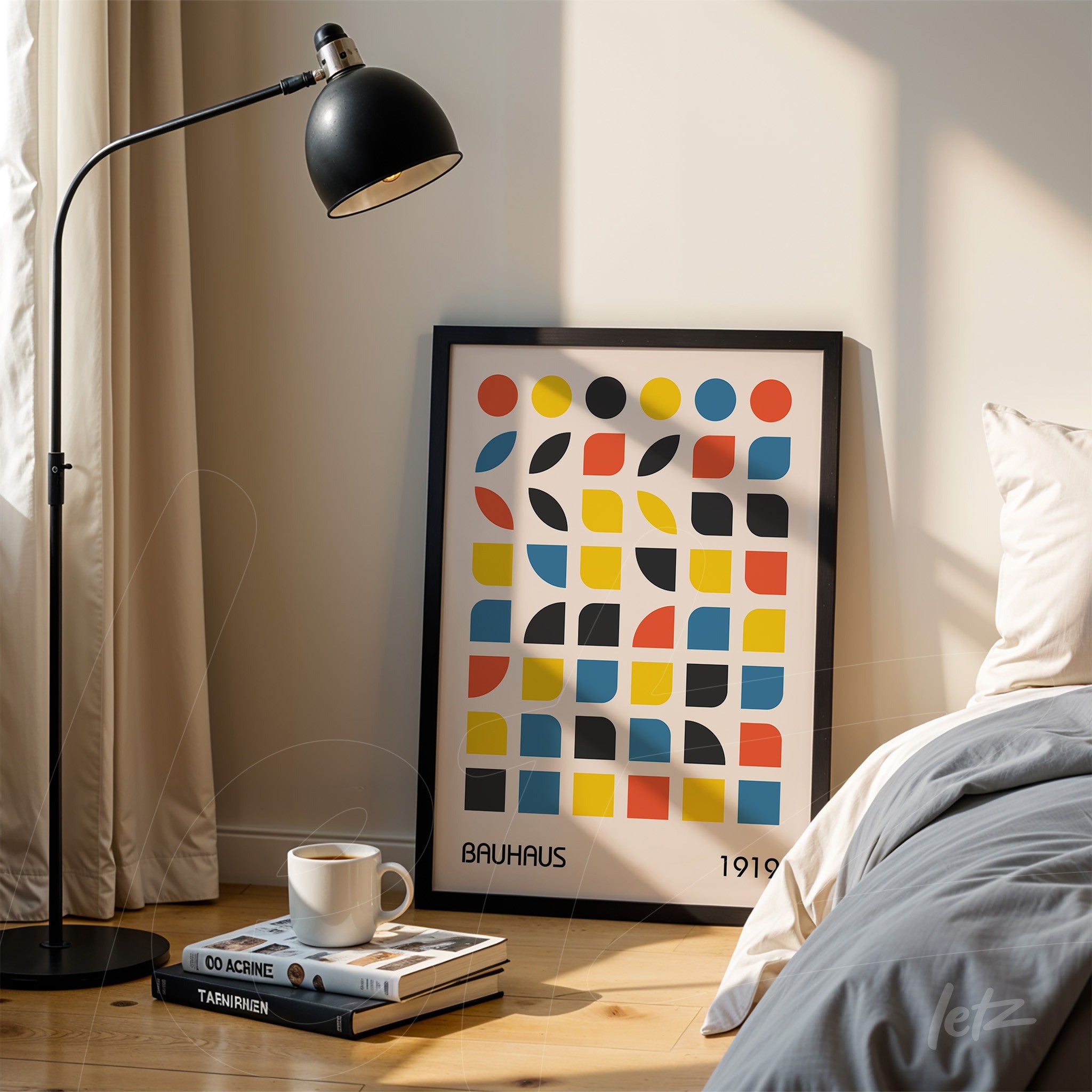 poster featuring colorful geometric pattern in black frame leaning on floor next to bed and lamp