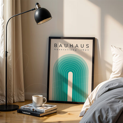 bauhaus style geometric poster displayed on wooden floor next to lamp and bed