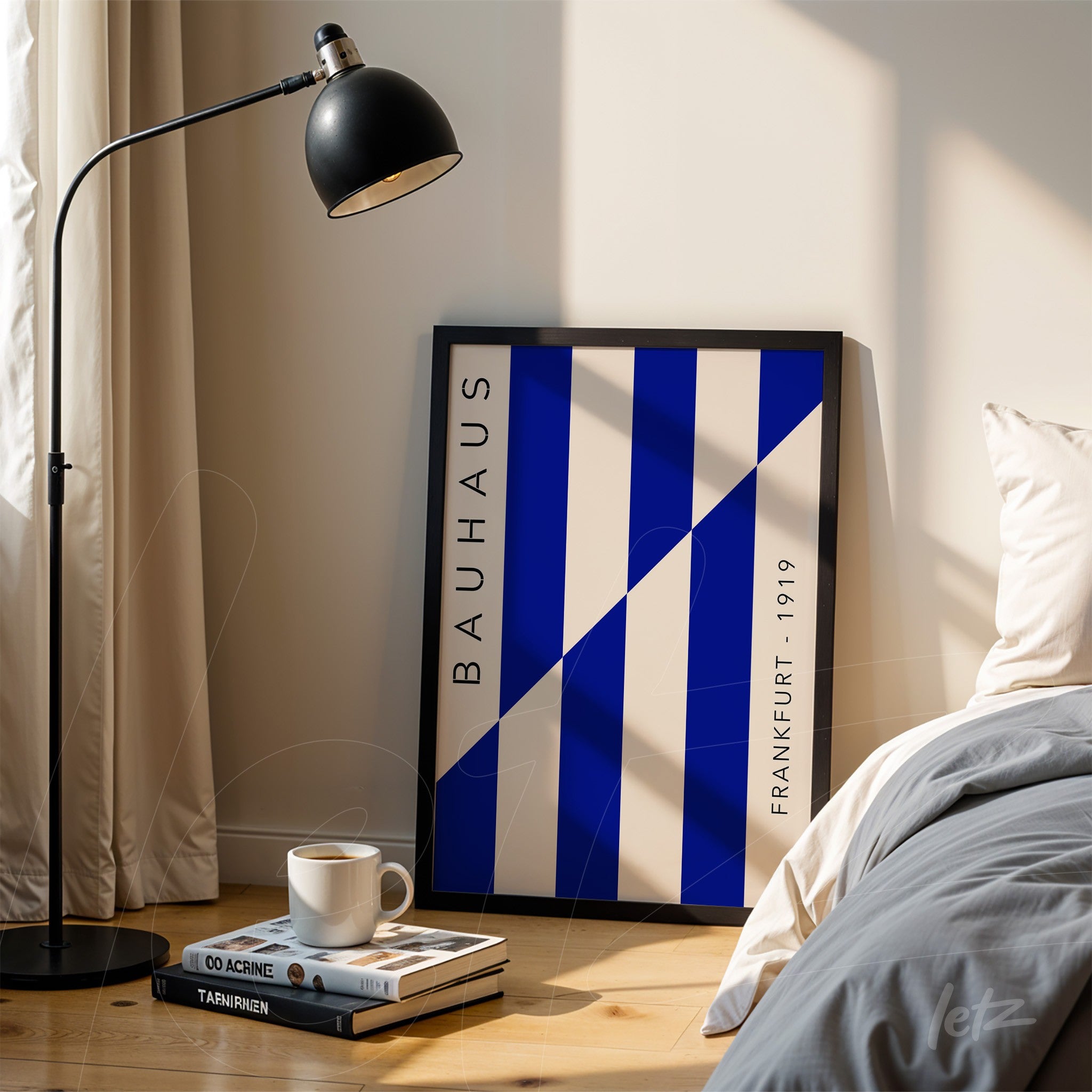 bauhaus style art print with blue and white diagonal stripes leaning against bedroom wall next to bed