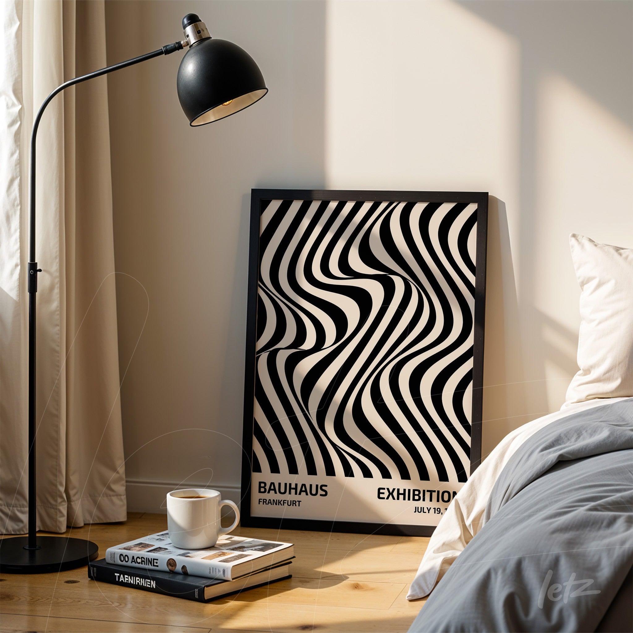 framed print with black and white wavy lines and the text 'bauhaus exhibition' leaning on the floor next to a bed