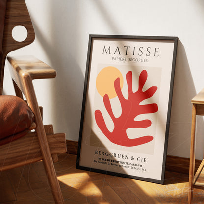 framed modern art print featuring abstract shapes in red and yellow with French text