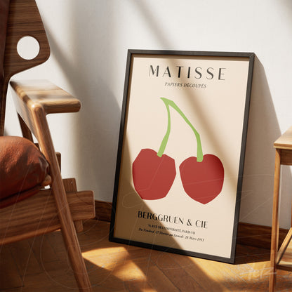 framed modern art featuring cherries in red and green with a light background
