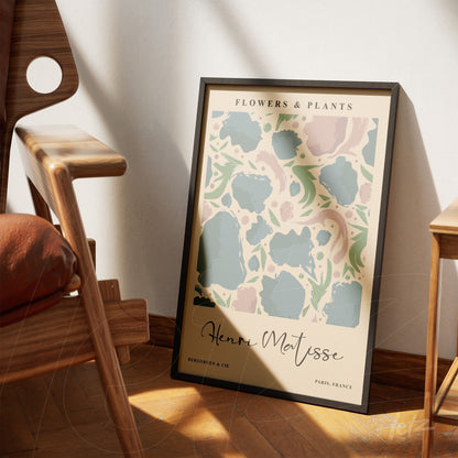 framed modern art print featuring colorful abstract shapes leaning beside a wooden chair