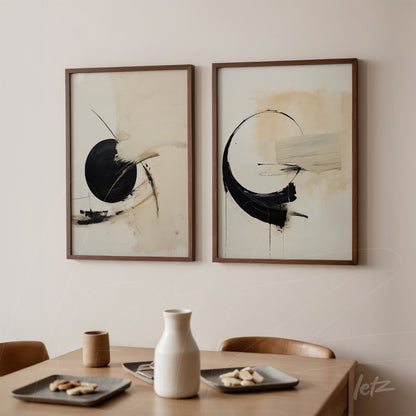 pair of framed abstract wall art in neutral tones with light wood frames displayed on a light wall
