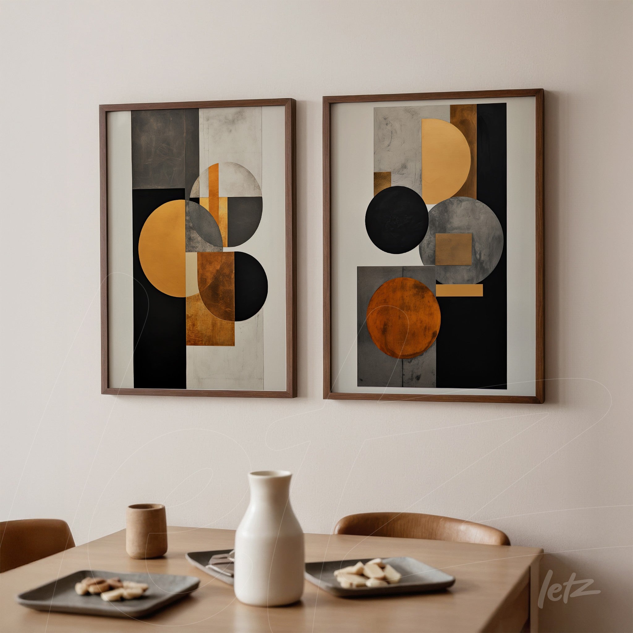 set of framed wall art featuring abstract design in black, gray, and gold tones with light wood frames