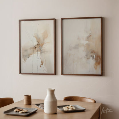 composition of abstract framed wall art in light brown frames featuring pastel tones of cream and beige on a light wall