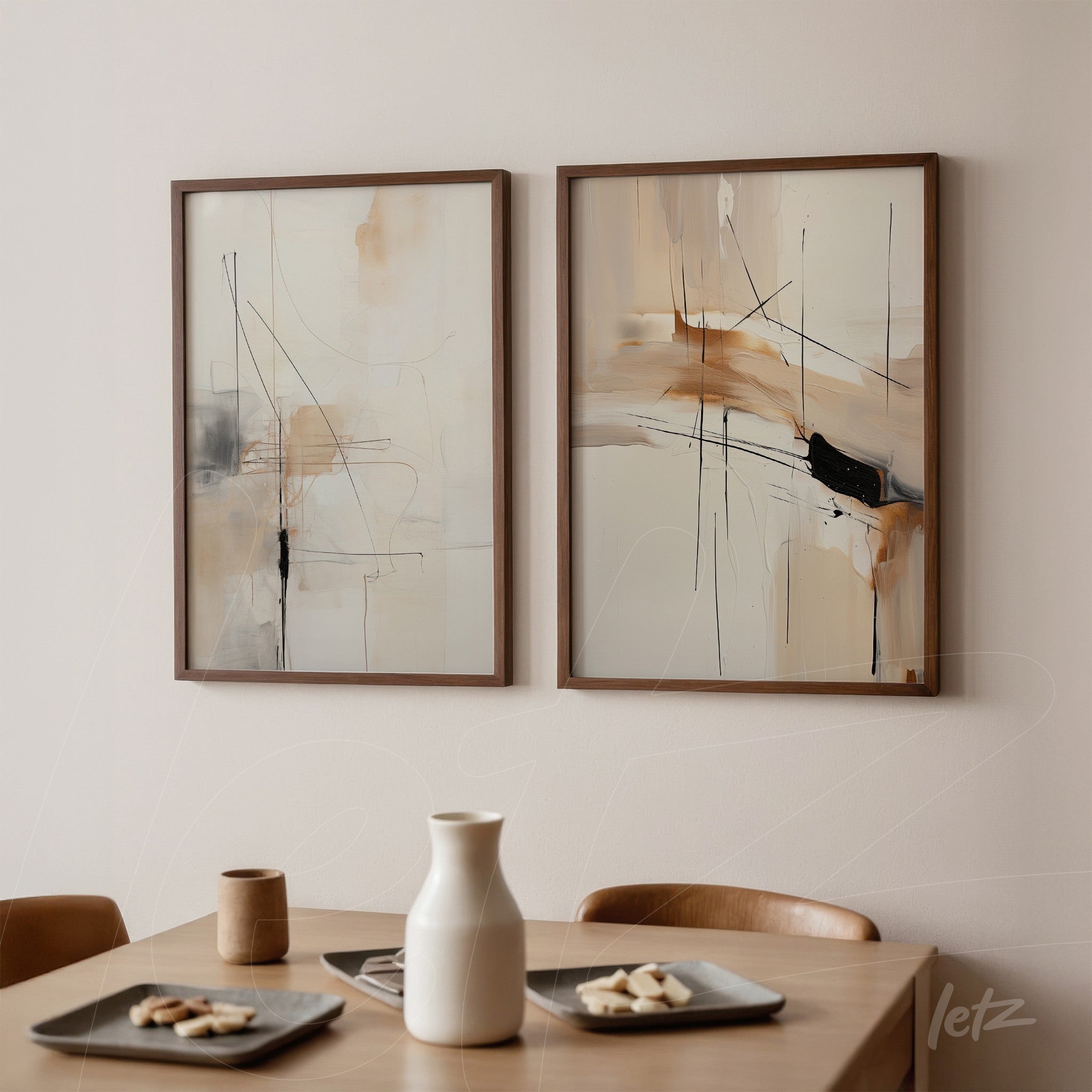 pair of framed abstract artworks in neutral tones with light wood frame, displayed on beige wall